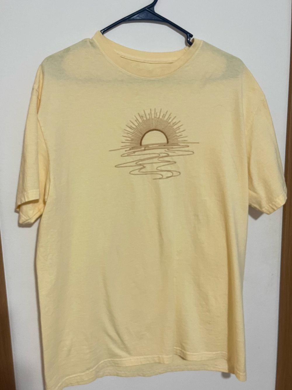 Maurice’s Soft Yellow Sun Graphic Tee, embroidered sun. Nice color,
